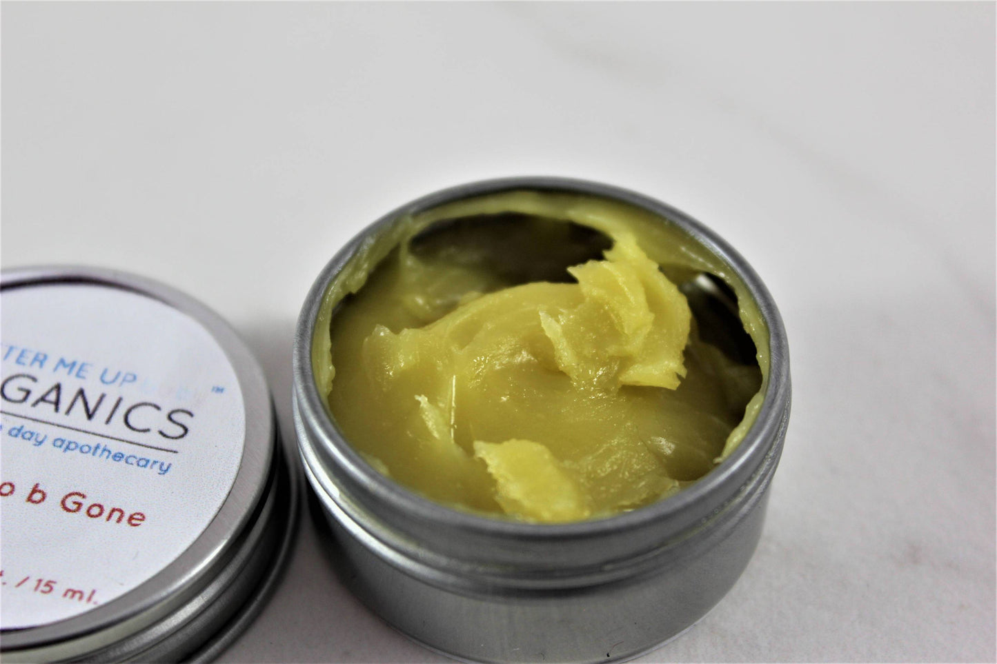 Boo Boo B Gone Butter Me uP Organic a modern day apothecary .5 oz balm open close up