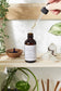 Organic Hair Oil 2 oz amber bottle butter me up organics open with dropper with a drop coming out of it