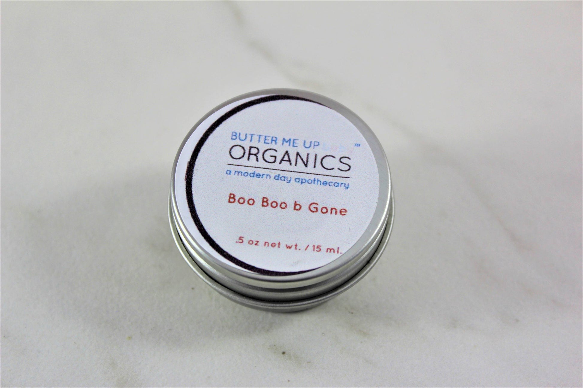Boo Boo B Gone Butter Me uP Organic a modern day apothecary .5 oz balm closed